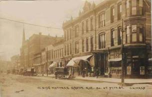 POSTCARD - CHICAGO - COTTAGE GROVE AVE AT 37TH - WAGONS - SIGNS - SEPIA - c1910